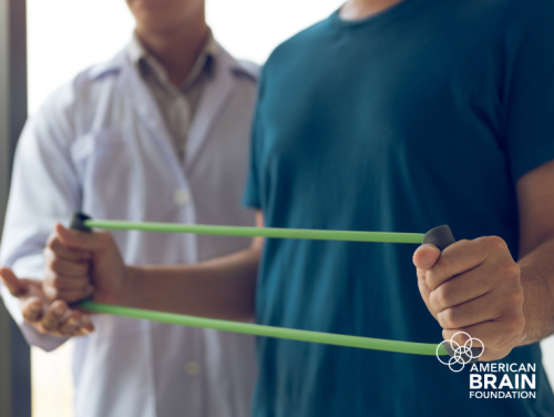 A physical therapy patient exercising using resistance bands.